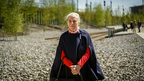Frieda Larsen standing in front of the ‘denk.mal Hannoverscher Bahnhof’ memorial site, 2017
